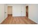 Empty room with wood-look floors offers an inviting space to customize at 805 Wesley Oak Rd, Sandy Springs, GA 30328