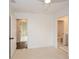 Bedroom featuring two doorways, a ceiling fan, and white walls at 805 Wesley Oak Rd, Sandy Springs, GA 30328