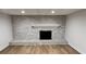 Modern brick fireplace with black opening, light gray bricks, and a white mantle at 805 Wesley Oak Rd, Sandy Springs, GA 30328