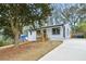 Charming renovated home with a well-maintained front yard and newly paved driveway at 3393 Phillip Cir, Decatur, GA 30032