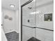 Elegant shower with white subway tile, a built in shelf, and black hexagon tile at 3393 Phillip Cir, Decatur, GA 30032
