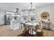 Open floorplan kitchen leading to a dining area with stainless steel appliances at 3393 Phillip Cir, Decatur, GA 30032