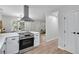 Bright kitchen featuring modern appliances, countertops, and an island cooktop at 3393 Phillip Cir, Decatur, GA 30032