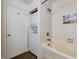 Bathroom with a tub, a shower, and in-unit washer and dryer at 44 Finch Ne Trl, Atlanta, GA 30308
