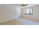 Bright bedroom features neutral carpeting, ceiling fan, and a window for plenty of natural light at 44 Finch Ne Trl, Atlanta, GA 30308