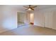 This bedroom features neutral carpeting, a large closet with mirrored doors and a second storage closet at 44 Finch Ne Trl, Atlanta, GA 30308