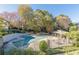 Serene community pool area surrounded by mature trees and a poolside cabana at 44 Finch Ne Trl, Atlanta, GA 30308