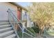 Inviting condo entrance featuring stairs leading to a vibrant orange front door at 44 Finch Ne Trl, Atlanta, GA 30308