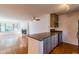 Open-concept living area with hardwood floors and a cozy fireplace at 44 Finch Ne Trl, Atlanta, GA 30308