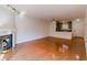 Cozy living area with a fireplace, hardwood floors and kitchen access at 44 Finch Ne Trl, Atlanta, GA 30308