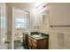 Bathroom featuring a granite countertop, double sinks and modern fixtures at 2837 Davidson Dr, Lithonia, GA 30058