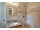 Bathroom featuring a granite countertop, tiled shower and modern fixtures at 2837 Davidson Dr, Lithonia, GA 30058