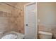 Bathroom featuring a granite countertop, tiled walls and modern fixtures at 2837 Davidson Dr, Lithonia, GA 30058