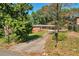 Traditional one-story home with a brick facade and a long driveway at 2837 Davidson Dr, Lithonia, GA 30058