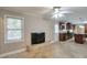 Cozy living area with tile flooring, a modern fireplace, and kitchen access at 2837 Davidson Dr, Lithonia, GA 30058
