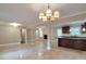 Spacious open living area with tile flooring and a partial view into kitchen at 2837 Davidson Dr, Lithonia, GA 30058
