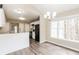 Kitchen and dining area with modern fixtures, abundant natural light, and a functional layout at 145 Price Hills Ct, Sugar Hill, GA 30518