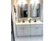 Stylish bathroom featuring a double vanity, modern fixtures, and neutral color palette at 1659 Olympian Sw Way, Atlanta, GA 30310