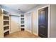 Spacious walk-in closet with built-in shelving and ample storage space at 1659 Olympian Sw Way, Atlanta, GA 30310