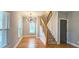 Entryway and staircase with modern lighting and hardwood floors at 1659 Olympian Sw Way, Atlanta, GA 30310