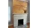 Unique fireplace with shiplap accent wall and white-painted brick at 1659 Olympian Sw Way, Atlanta, GA 30310