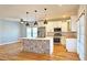 Modern kitchen with an island featuring designer details, stainless steel appliances, and updated countertops at 1659 Olympian Sw Way, Atlanta, GA 30310