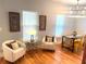 Cozy living space with stylish seating, hardwood floors, and modern light fixtures at 1659 Olympian Sw Way, Atlanta, GA 30310