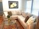 Comfortable living room featuring a plush sectional sofa, patterned rug, and bright natural light at 1659 Olympian Sw Way, Atlanta, GA 30310