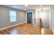 Open concept living area with hardwood floors, modern lighting, and natural light at 1659 Olympian Sw Way, Atlanta, GA 30310