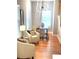 Bright dining area with modern chandelier, stylish chairs, and gleaming hardwood floors at 1659 Olympian Sw Way, Atlanta, GA 30310