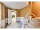 Basement with stairs, tan wallpaper and a doorway at 1742 Dunridge Ct, Dunwoody, GA 30338