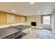 Basement area with a fireplace, window, and tan-colored walls at 1742 Dunridge Ct, Dunwoody, GA 30338