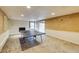 Basement room with a fireplace, ping pong table, and tan wallpaper at 1742 Dunridge Ct, Dunwoody, GA 30338