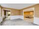 Basement rec room with tan wallpaper and openings to other areas at 1742 Dunridge Ct, Dunwoody, GA 30338