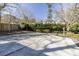 Concrete backyard basketball court offering recreational space for sports and outdoor activities at 1742 Dunridge Ct, Dunwoody, GA 30338