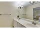 Bathroom featuring a double vanity with chrome faucets and a well-lit mirror at 1742 Dunridge Ct, Dunwoody, GA 30338
