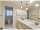 Bathroom with double sinks, large mirror, and tiled floor at 1742 Dunridge Ct, Dunwoody, GA 30338