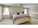 Spacious bedroom with carpet, two windows, and white trim at 1742 Dunridge Ct, Dunwoody, GA 30338