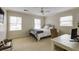 Bedroom featuring carpet, two windows, and a desk at 1742 Dunridge Ct, Dunwoody, GA 30338