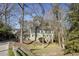 Charming two-story home featuring stone accents, lush landscaping, and a welcoming front entrance at 1742 Dunridge Ct, Dunwoody, GA 30338