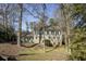 Charming two-story home featuring stone accents, lush landscaping, and a welcoming front entrance at 1742 Dunridge Ct, Dunwoody, GA 30338