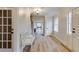 Inviting foyer with light wood floors, a staircase, and white trim at 1742 Dunridge Ct, Dunwoody, GA 30338