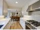 Stylish kitchen showcases white cabinets, stainless steel range, and subway tile backsplash at 1742 Dunridge Ct, Dunwoody, GA 30338