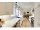 Bright kitchen with white countertops, stainless steel appliances, and modern lighting at 1742 Dunridge Ct, Dunwoody, GA 30338