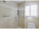 Walk-in shower with glass enclosure, tile surround, and a convenient shower seat at 1742 Dunridge Ct, Dunwoody, GA 30338
