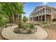 Expansive backyard with a charming garden area, featuring a screened porch and brick exterior at 180 Winecoff Dr, Fayetteville, GA 30214