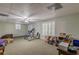 Spacious basement with carpeting, neutral walls, and a variety of items, offering potential for customization at 180 Winecoff Dr, Fayetteville, GA 30214