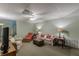 Open carpeted basement with neutral tones, comfortable seating, and ample lighting at 180 Winecoff Dr, Fayetteville, GA 30214
