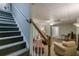 Cozy carpeted basement featuring stairs to upstairs and comfortable seating with ample lighting at 180 Winecoff Dr, Fayetteville, GA 30214