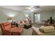 Spacious carpeted basement with comfortable seating, a television, and ample lighting at 180 Winecoff Dr, Fayetteville, GA 30214
